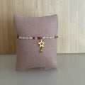 Bracelet élastiqueNairobi – Perles rouges & roses, étoiles dorées