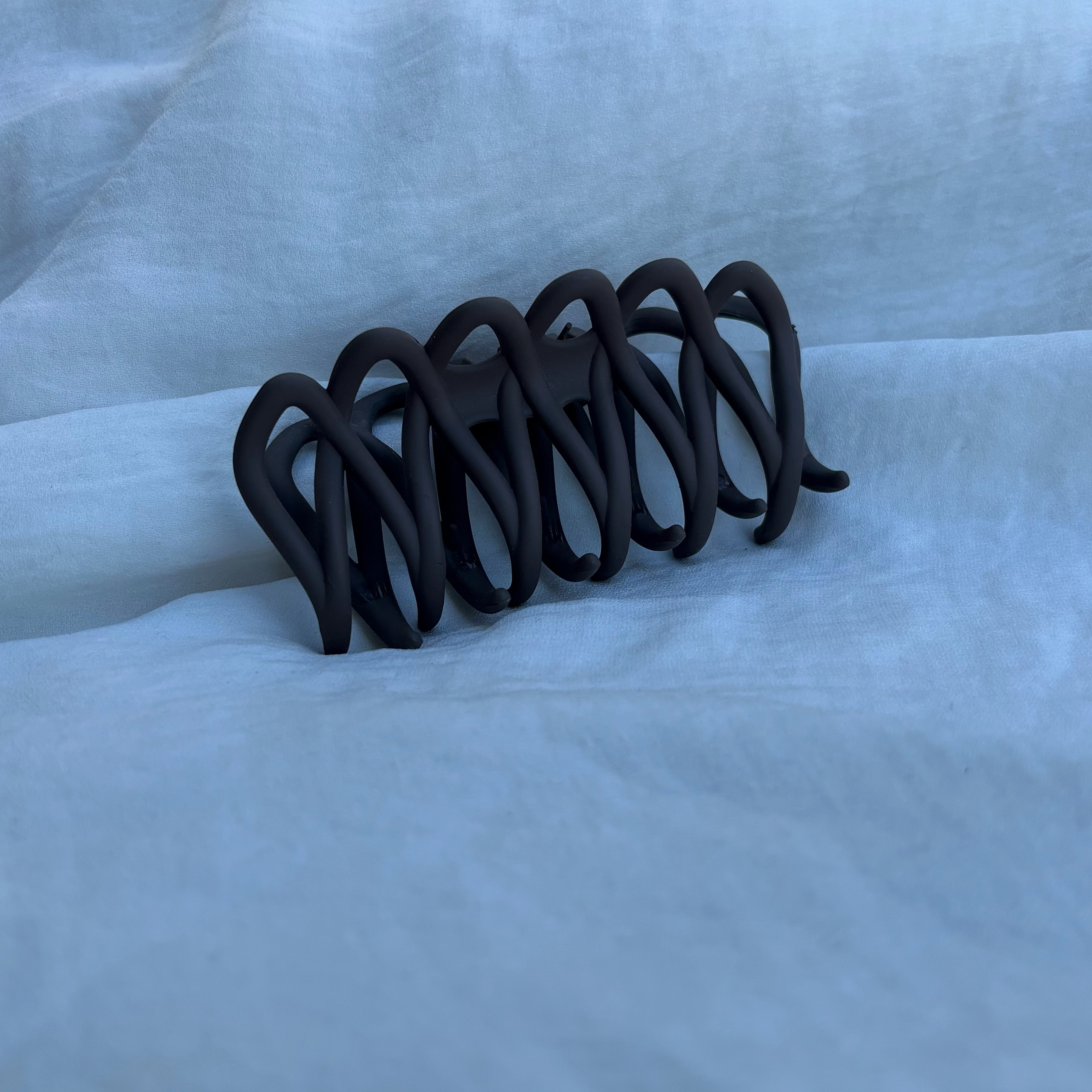 Pince entremêlée marron