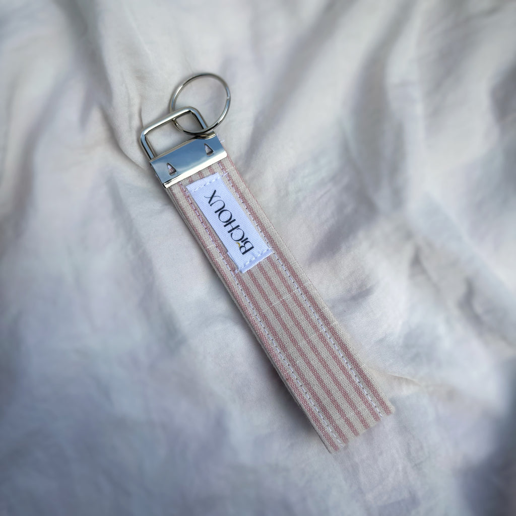 Porte Clé Arcturus - Motif rayé rose et blanc avec finitions argentées