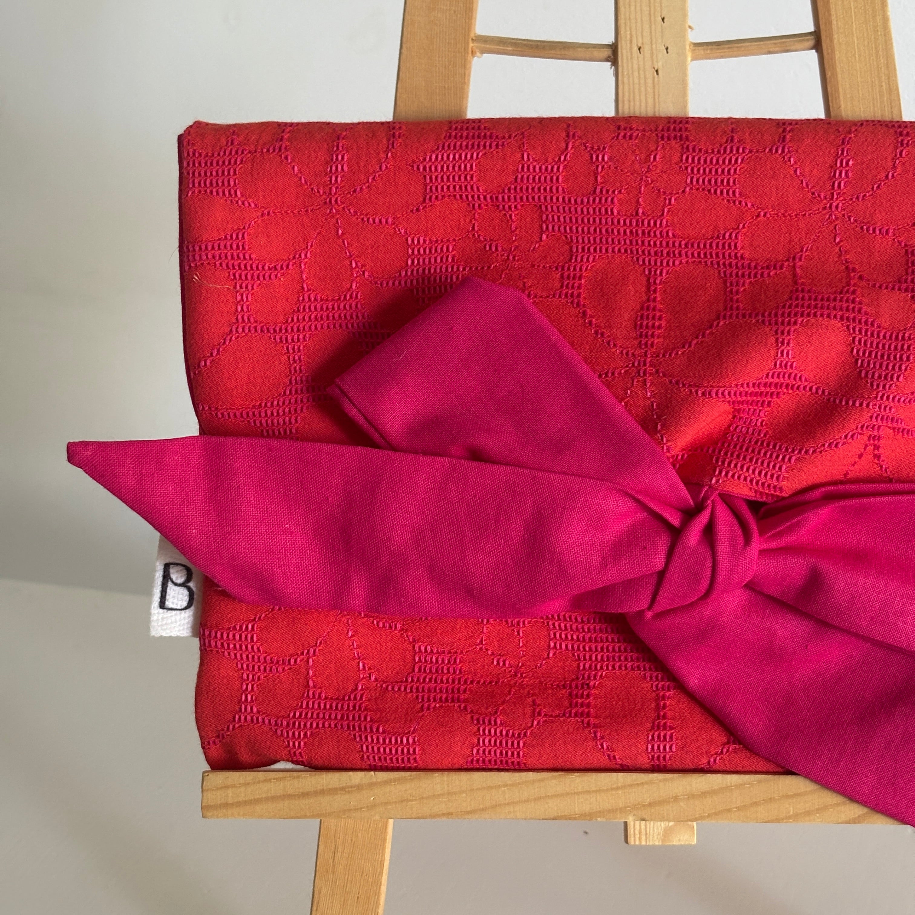 Pochette nouée fuchsia & orange en jacquard
