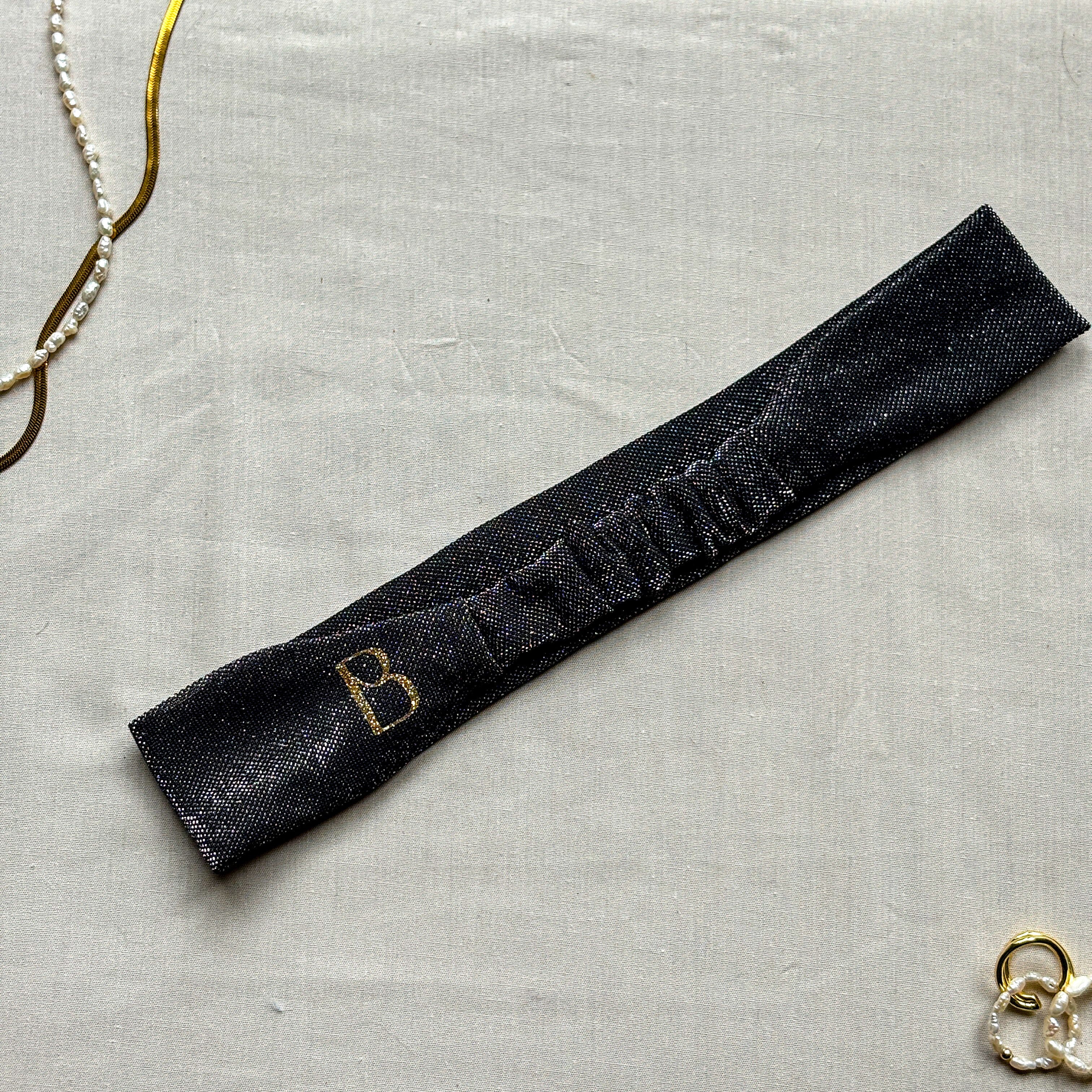 Bandeau Nola noir à paillettes argentées