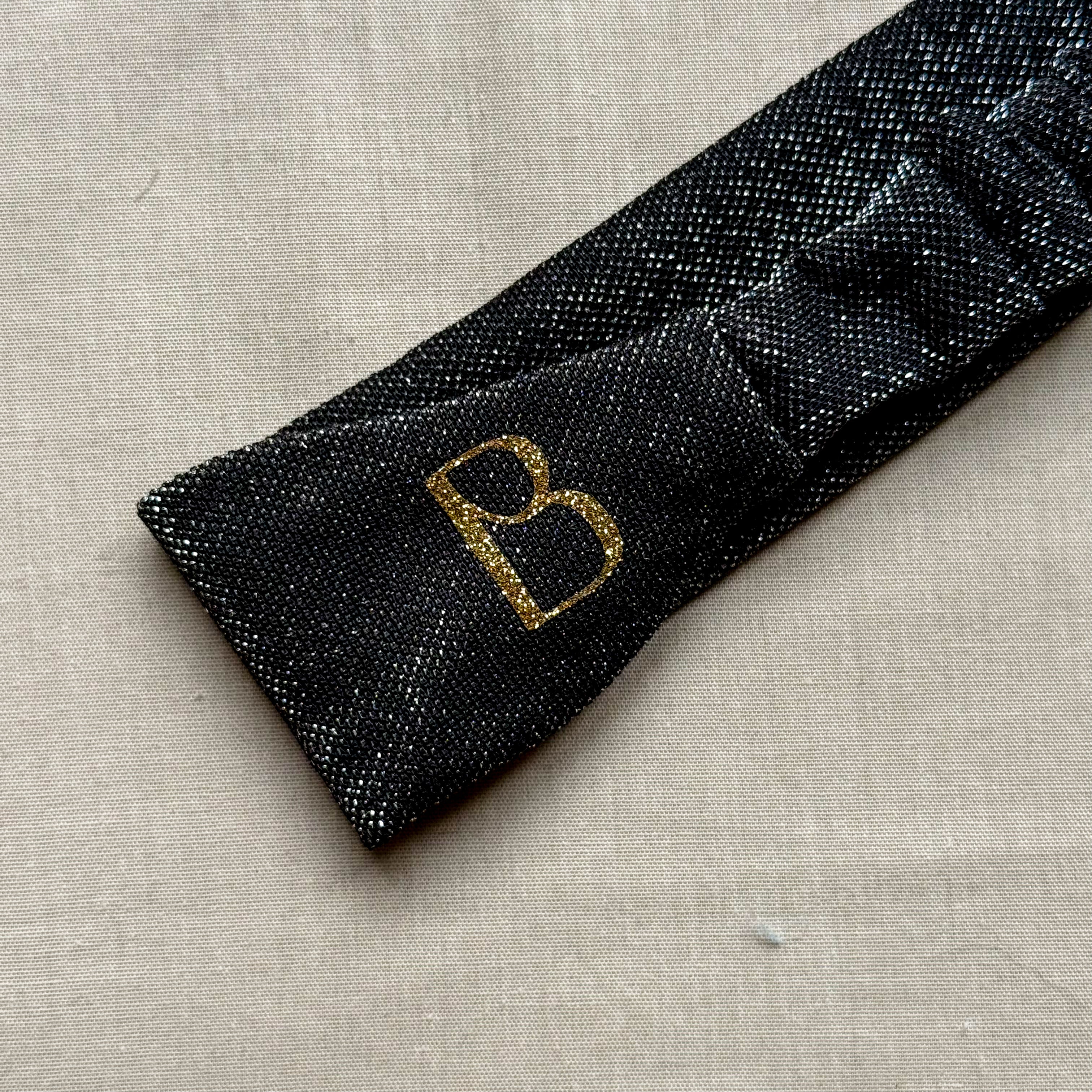 Bandeau Nola noir à paillettes argentées