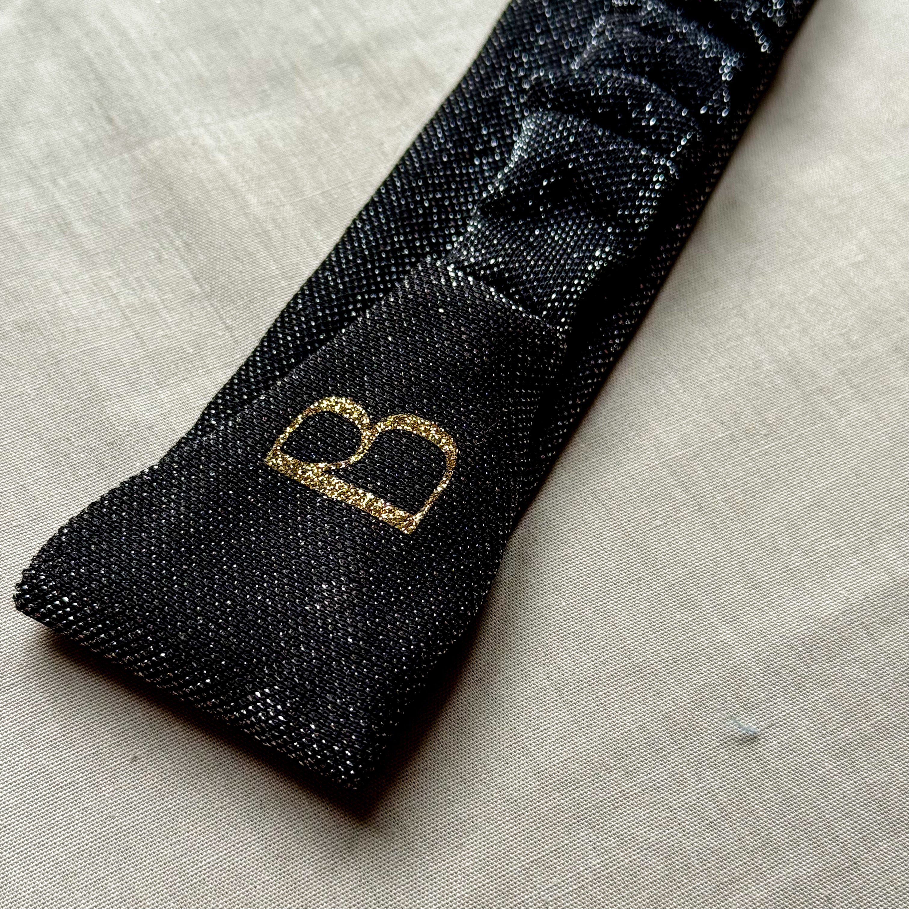 Bandeau Nola noir à paillettes argentées