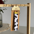 Porte-clés Dakota – Motif vache avec finitions dorées